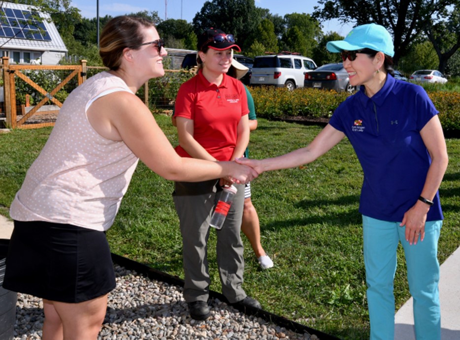Allison Roe shakes hands with Maryland First Lady Yumi Hogan.