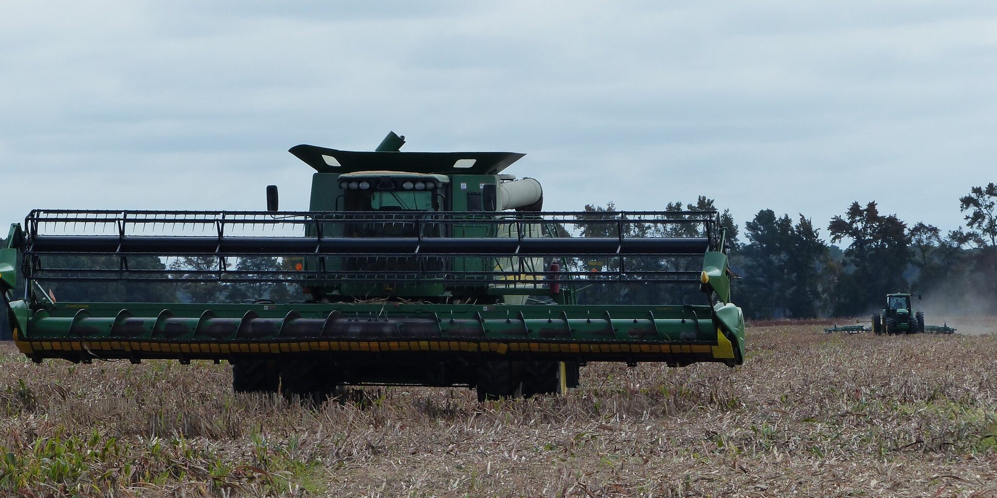 Combine harvesting crops in a field